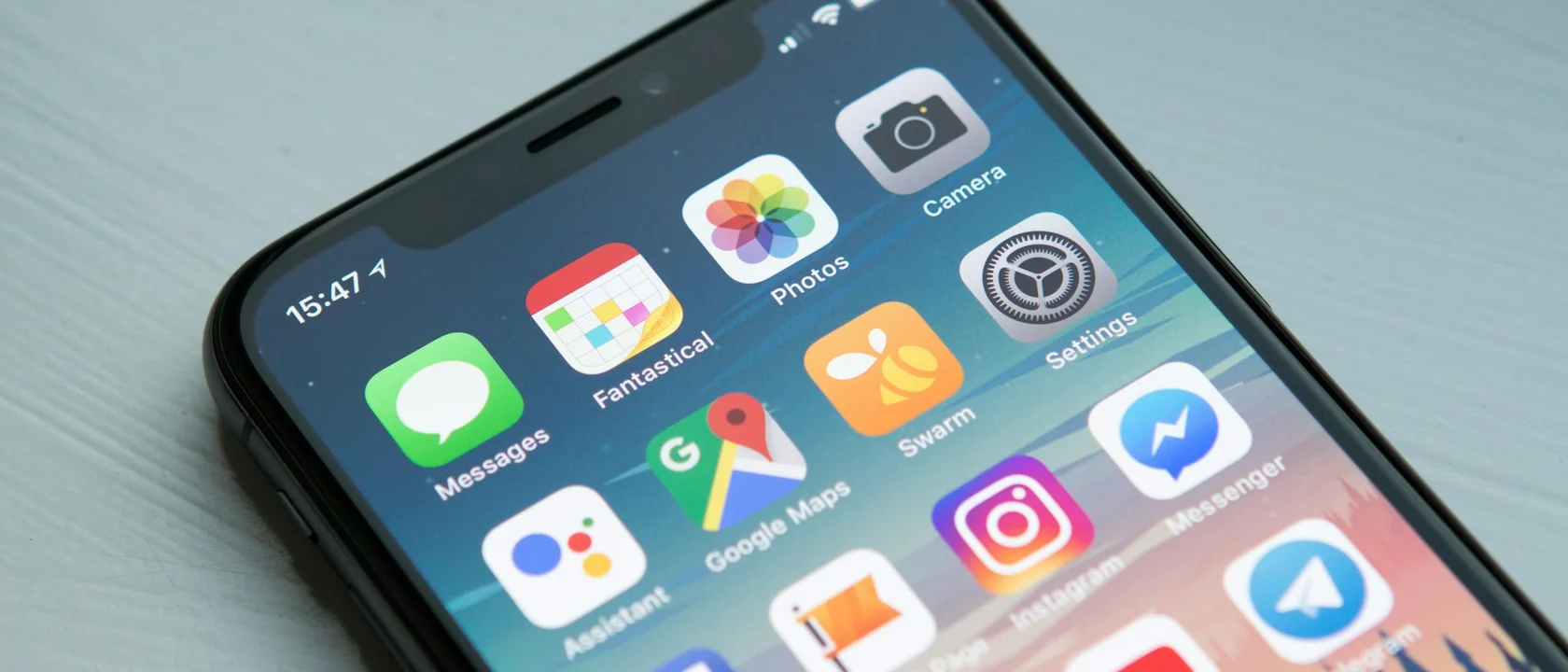 Person holding a smartphone with a business app on screen