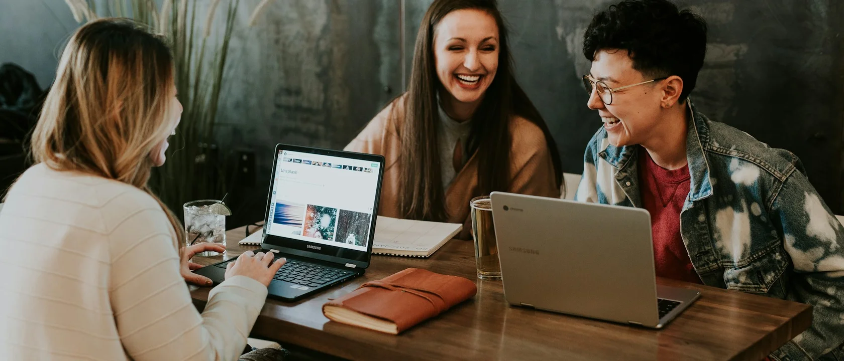 Business owner comparing smartphone app and browser dashboard side by side